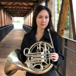 Rachel Aragaki holding a french horn
